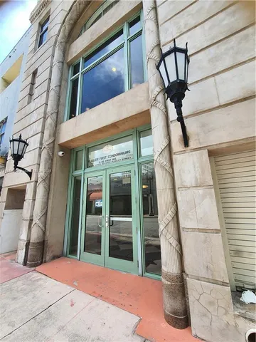a kitchen with a refrigerator and a stove