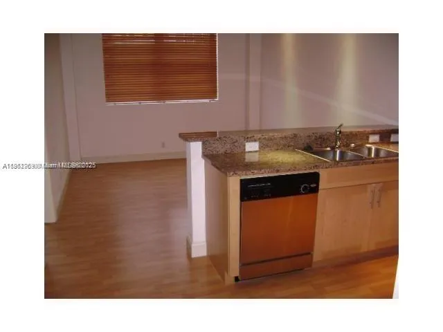 a bedroom with a bed and chair