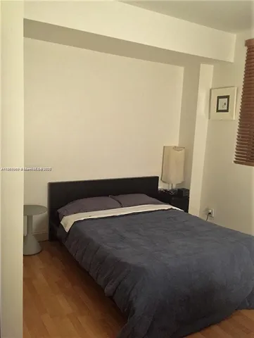 a bathroom with a sink toilet and mirror