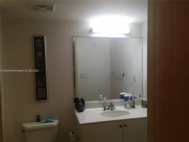 a bathroom with a toilet a sink and bathtub