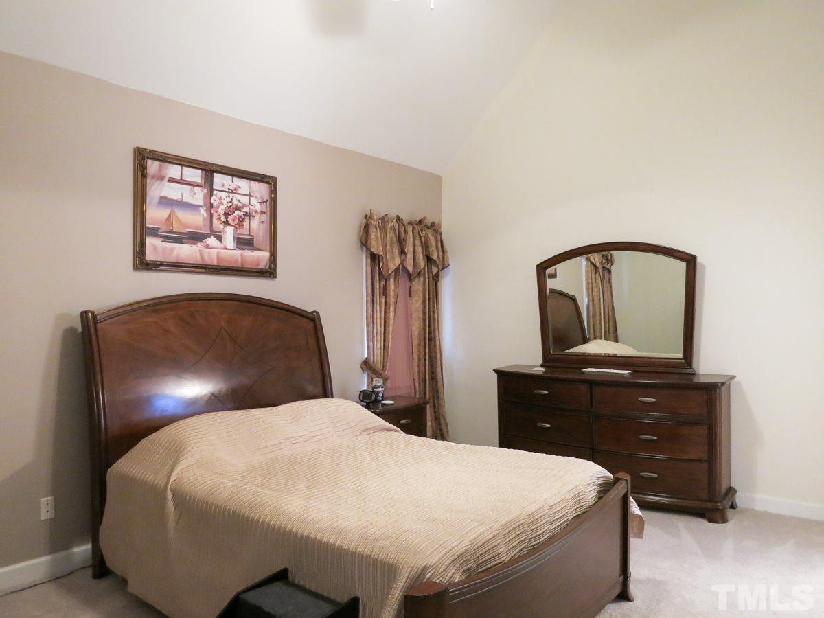 2845 Praire View Point Wendell, NC 27591 - Photo 12 of 25 The lg vaulted 1st floor Master Bedroom features new neutral carpet, CF, lg WIC & private Bath.
