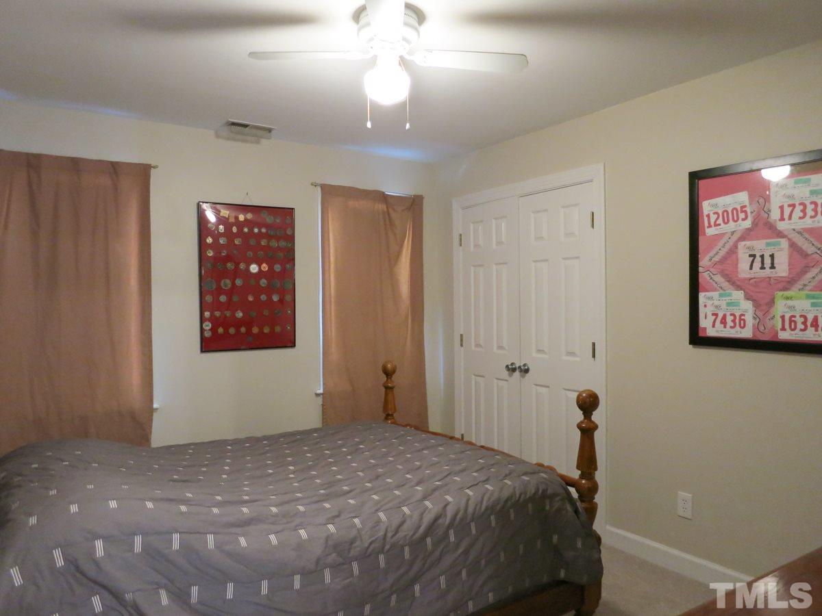 2845 Praire View Point Wendell, NC 27591 - Photo 15 of 25 2nd floor: new neutral carpet thruout: landing overlooks LR & Foyer below; 2 Bedrooms w/lg closets & CFs plus lg Bonus Rm that could be BR4. This is Bedroom 2.