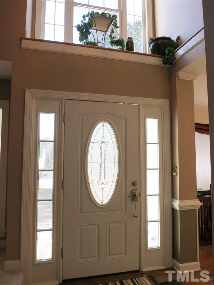 2845 Praire View Point Wendell, NC 27591 - Photo 3 of 25 The covered front Entry leads to the 2-story tall Foyer w/hardwood floor, display niches & coat closet.