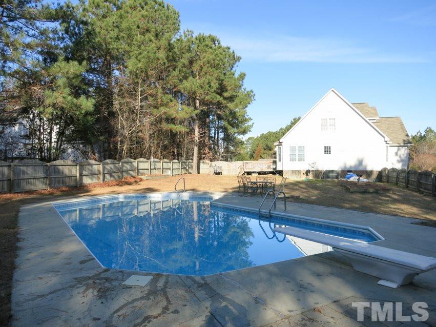 2845 Praire View Point Wendell, NC 27591 - Photo 23 of 25 Another view of the in-ground pool and fenced Backyard.