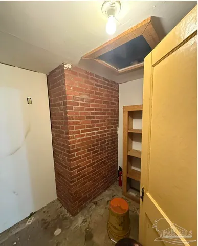 a bathroom with a toilet and shower