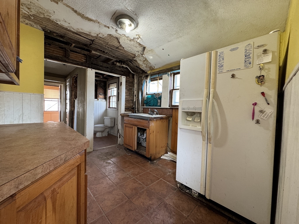 16 Pebble Avenue Winthrop, MA 02152 - Photo 11 of 17 a kitchen with refrigerator and countertop
