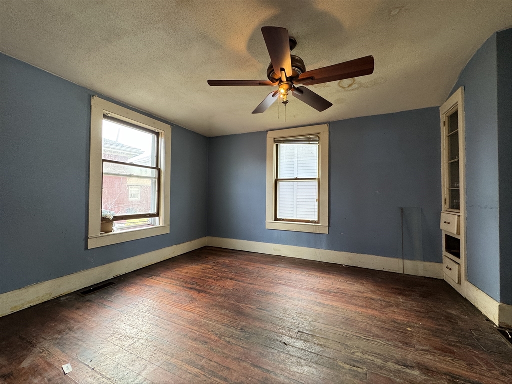 16 Pebble Avenue Winthrop, MA 02152 - Photo 8 of 17 a view of a livingroom with a ceiling fan and window