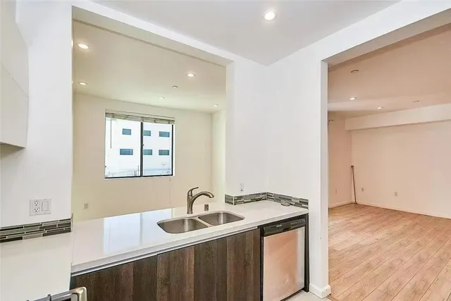 a kitchen with a sink and cabinets
