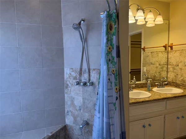 a bathroom with a sink and mirror