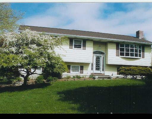16 Regen Road Danbury, CT 06811 - Photo 1 of 1 a front view of a house with a garden