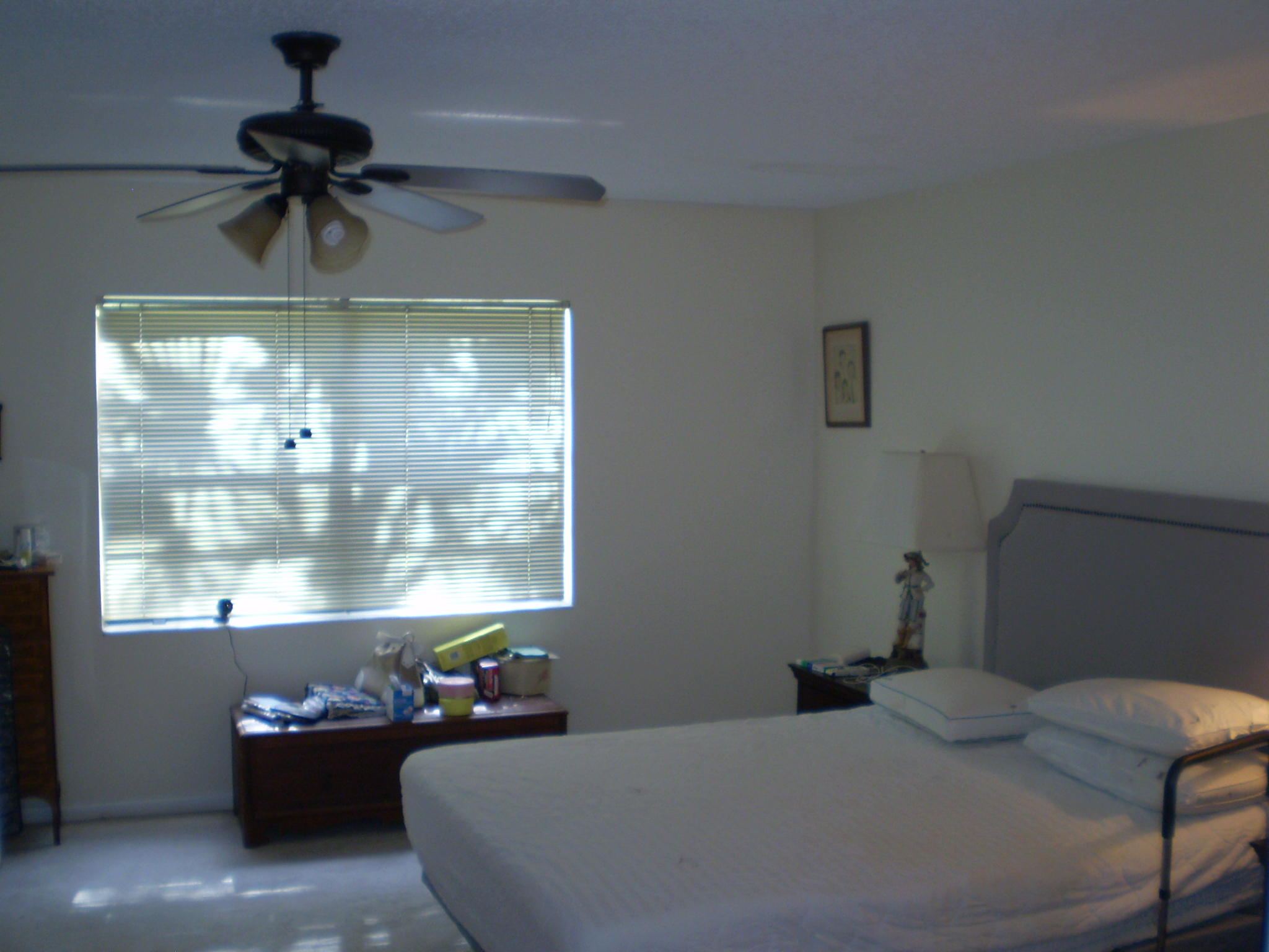 7970 Eastlake Drive, Unit 15A Boca Raton, FL 33433 - Photo 11 of 12 a bedroom with a bed and a chandelier