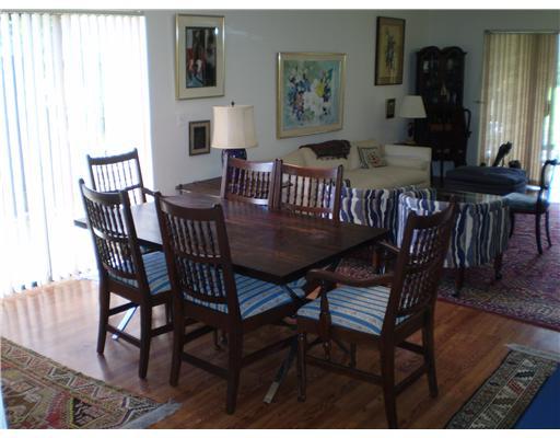 7970 Eastlake Drive, Unit 15A Boca Raton, FL 33433 - Photo 5 of 12 a view of a dining room with furniture and wooden floor