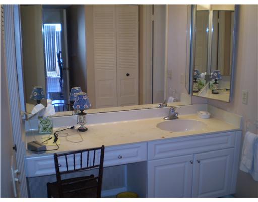 7970 Eastlake Drive, Unit 15A Boca Raton, FL 33433 - Photo 10 of 12 a bathroom with a sink and a mirror