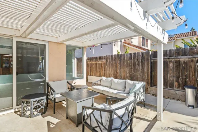 a patio with a patio table and chairs