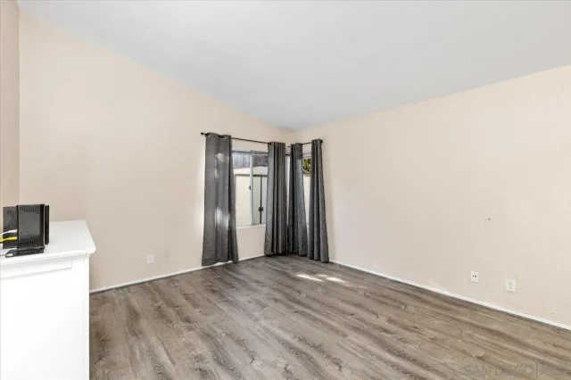 a room with a cabinets and a dresser