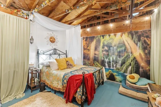 a bedroom with furniture and a bed