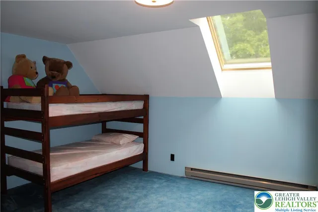 a bathroom with a toilet a sink and shower