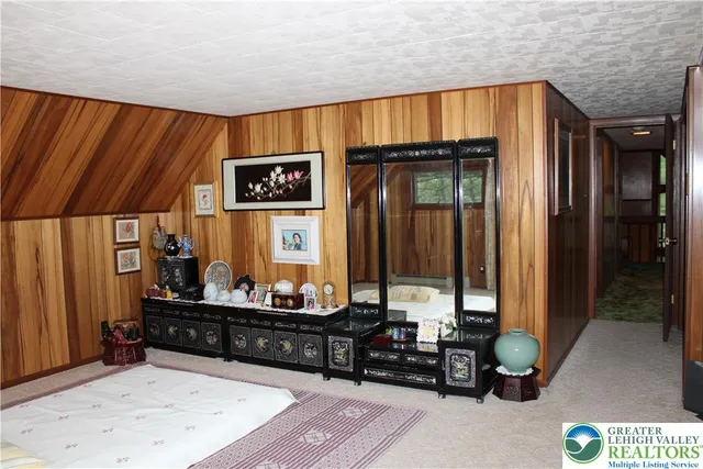 a bedroom with bed and a window