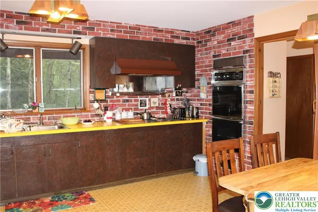 a kitchen with a sink and refrigerator