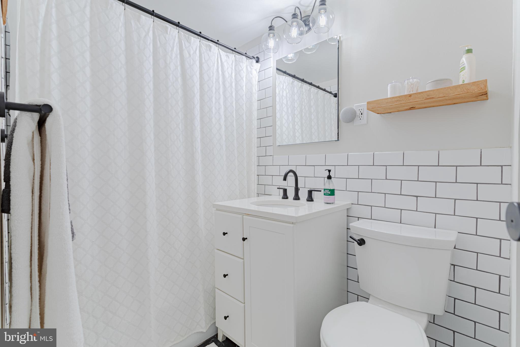 730 24th Street Northwest, Unit 718 Washington, DC 20037 - Photo 21 of 41 fully remodeled bathroom