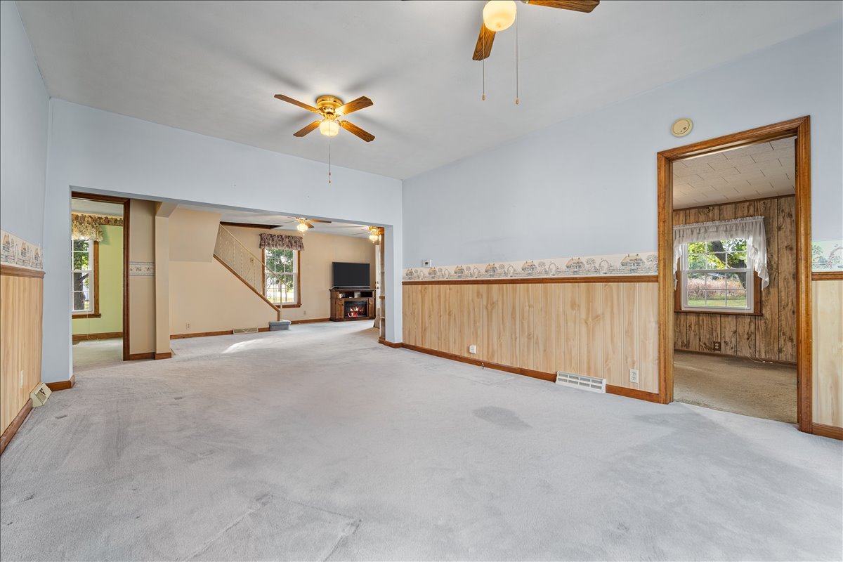 200 North Front Street Odell, IL 60460 - Photo 11 of 40 an empty room with a ceiling fan and a window