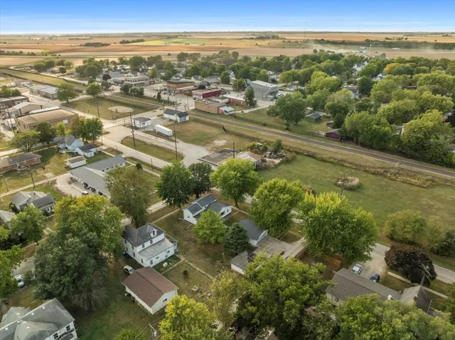 an aerial view of residential building with outdoor space and lake view