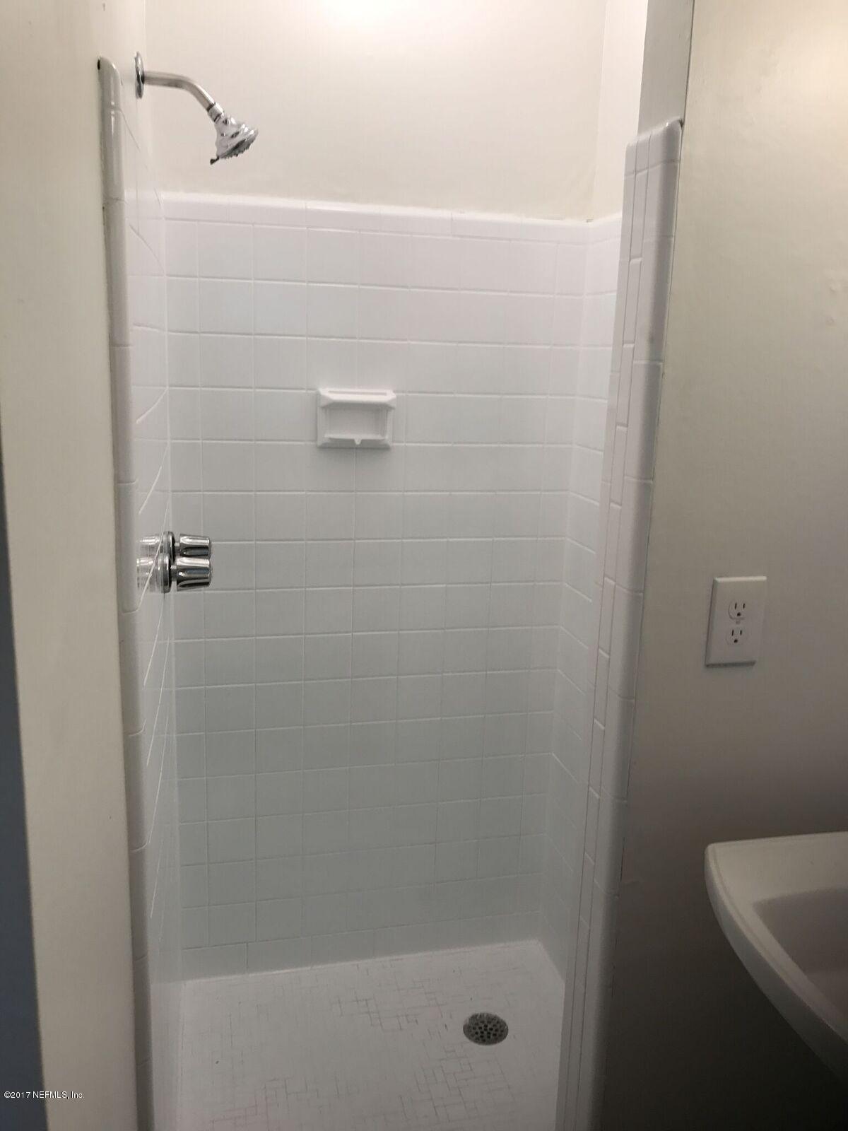 5249 Damascus Road South Jacksonville, FL 32207 - Photo 8 of 9 a bathroom with a shower and a sink