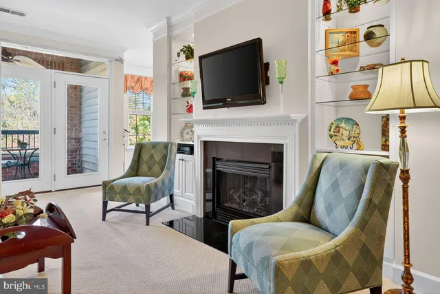 a living room with furniture fireplace and flat screen tv