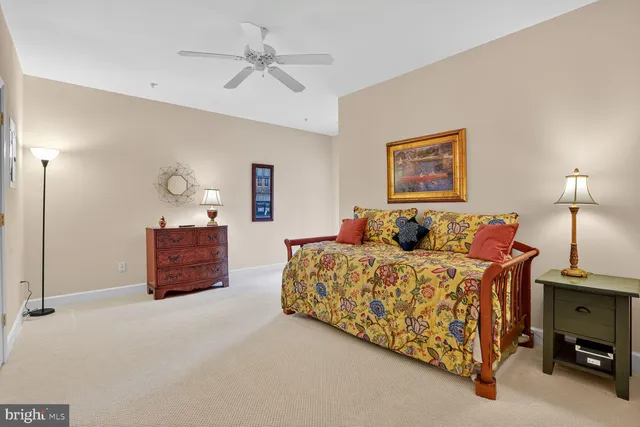 a bathroom with a toilet a sink and a mirror