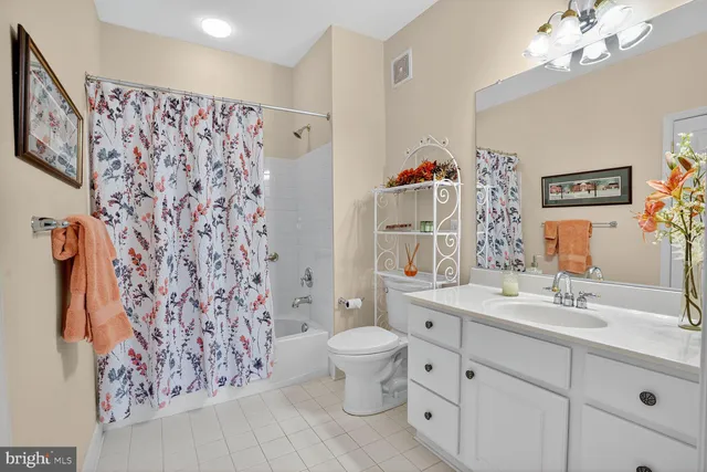 a bedroom with a bed and a lamp