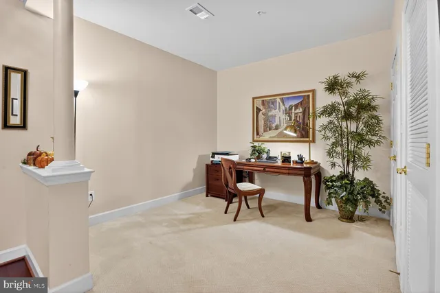 a view of a workspace with furniture