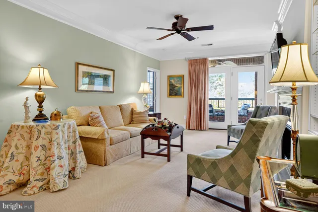 a living room with furniture fireplace and a window