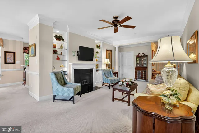a living room with furniture fireplace and flat screen tv