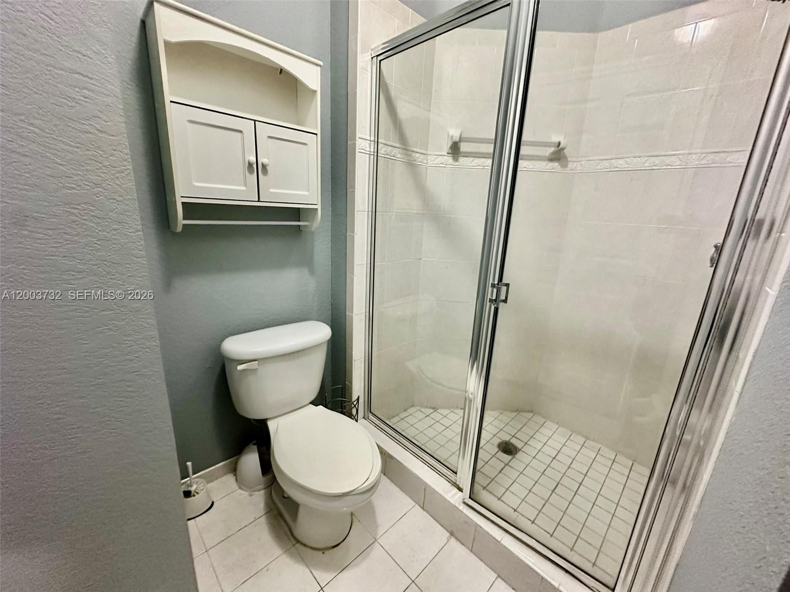 16537 Southwest 78th Terrace Miami, FL 33193 - Photo 11 of 34 a white toilet sitting next to a bathroom sink