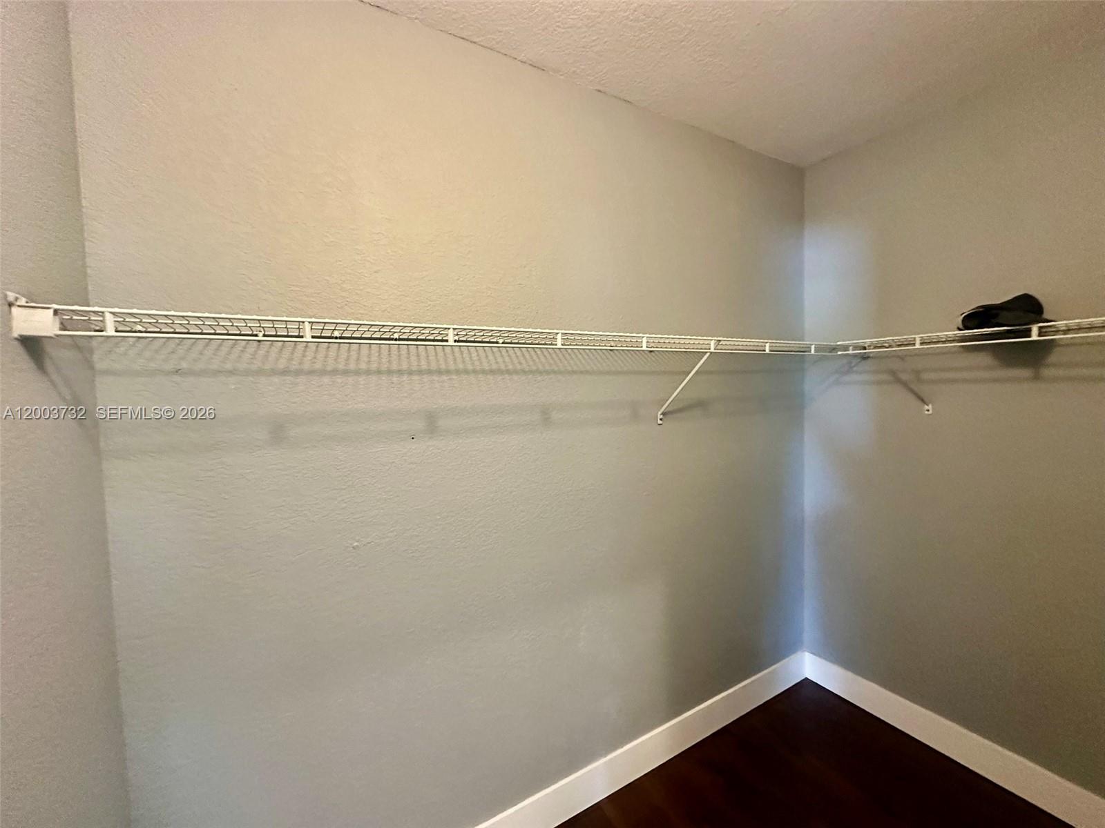 16537 Southwest 78th Terrace Miami, FL 33193 - Photo 21 of 34 a view of a room with racks on the wall
