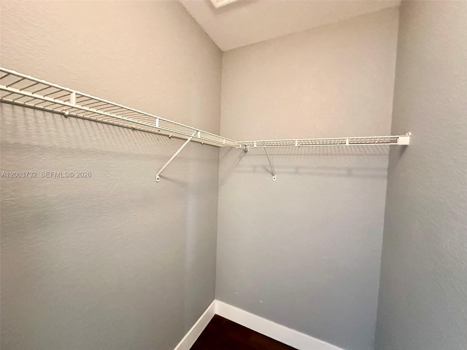 16537 Southwest 78th Terrace Miami, FL 33193 - Photo 22 of 34 a view of a room with racks on the wall