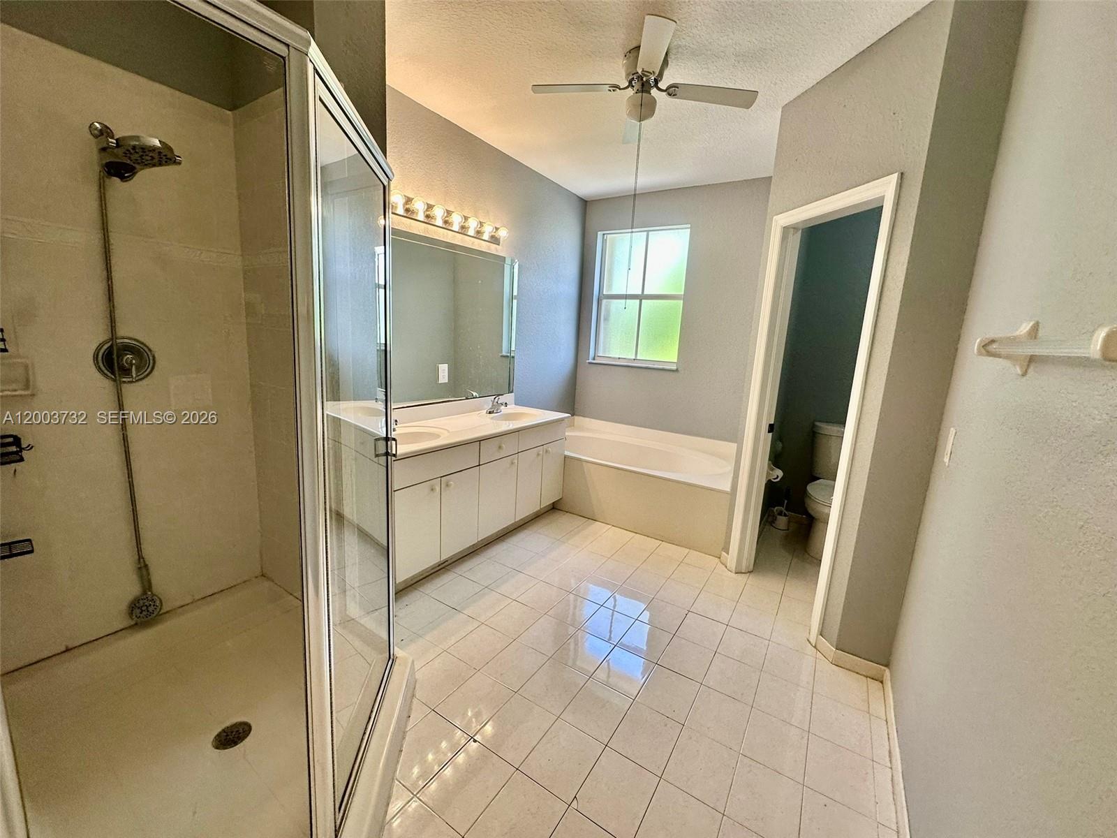 16537 Southwest 78th Terrace Miami, FL 33193 - Photo 23 of 34 a bathroom with a tub sink and shower