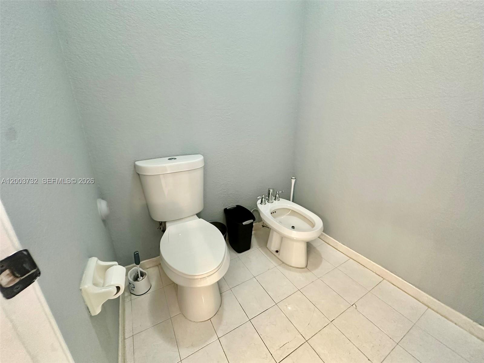 16537 Southwest 78th Terrace Miami, FL 33193 - Photo 24 of 34 a white toilet sitting next to a white walls