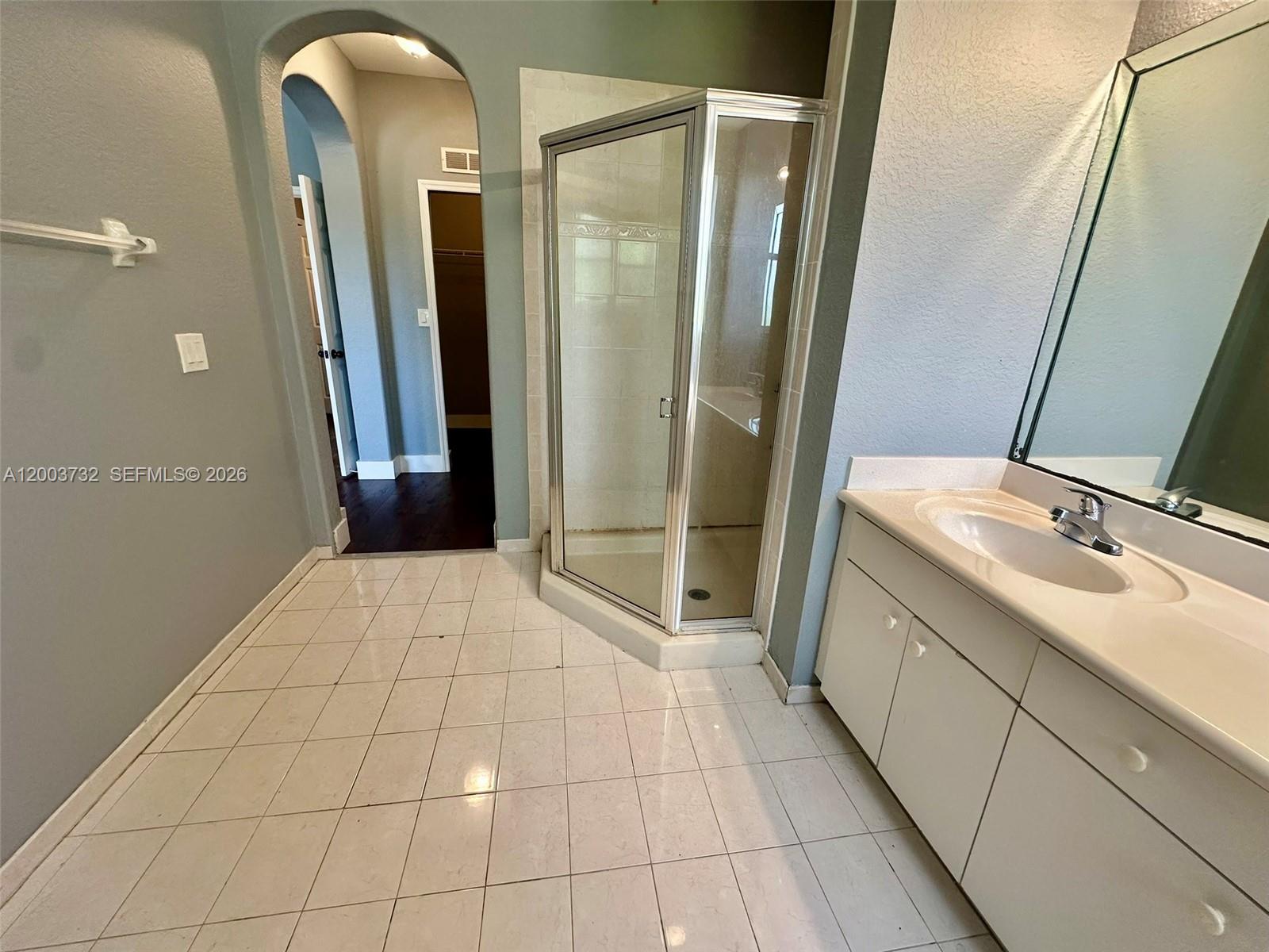 16537 Southwest 78th Terrace Miami, FL 33193 - Photo 26 of 34 a bathroom with a double vanity sink and shower