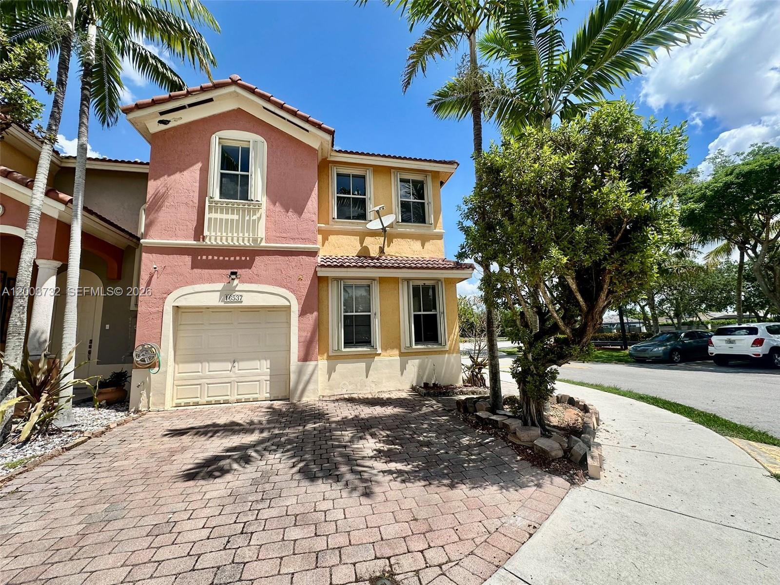 16537 Southwest 78th Terrace Miami, FL 33193 - Photo 32 of 34 a front view of a house with a yard