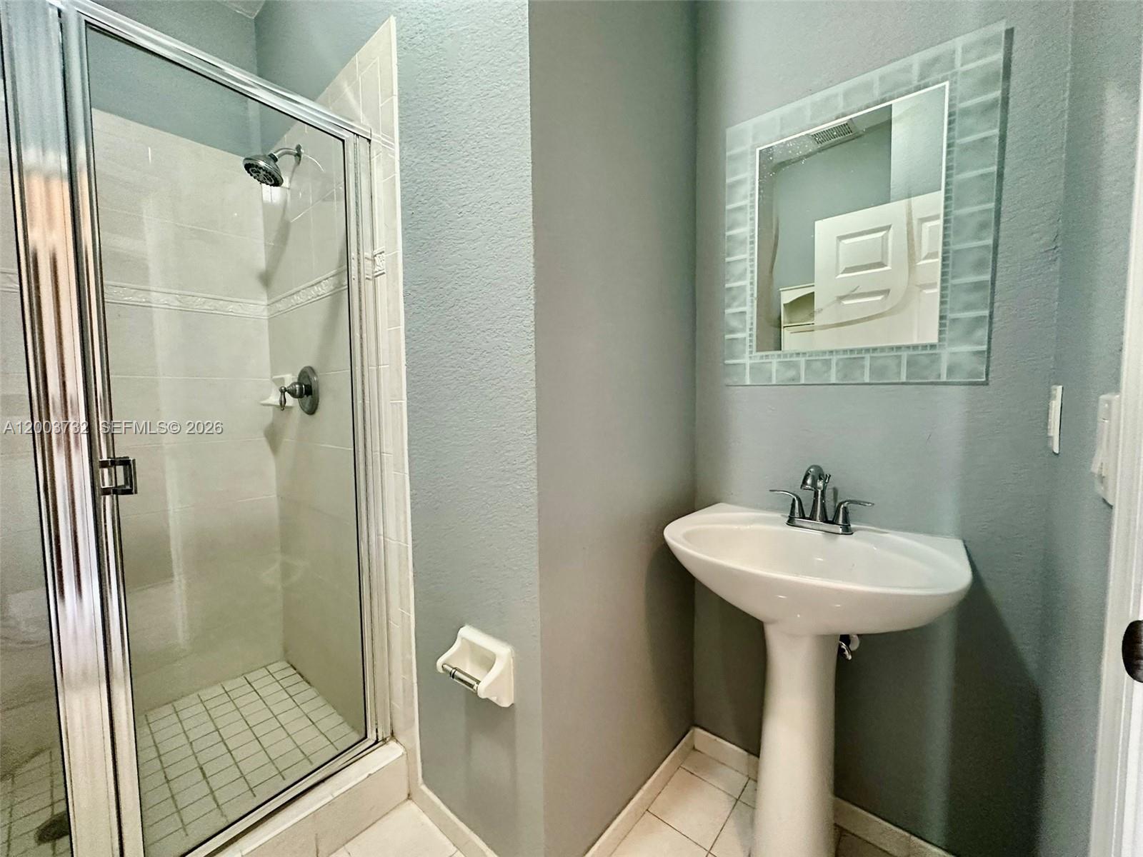 16537 Southwest 78th Terrace Miami, FL 33193 - Photo 10 of 34 a bathroom with a sink a toilet and shower