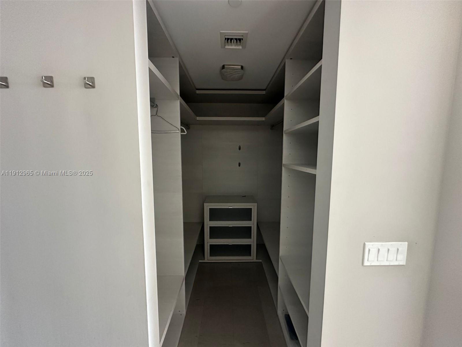 68 Southeast 6th Street, Unit 2205 Miami, FL 33131 - Photo 22 of 28 a view of walk in closet