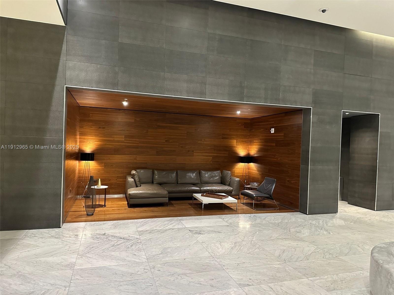 68 Southeast 6th Street, Unit 2205 Miami, FL 33131 - Photo 4 of 28 a room with gym equipment