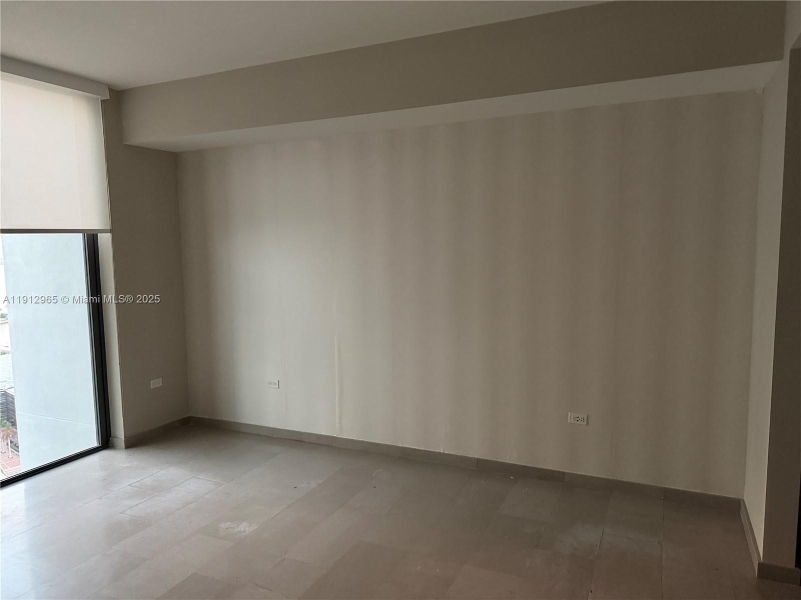 68 Southeast 6th Street, Unit 2205 Miami, FL 33131 - Photo 9 of 28 a view of an empty room