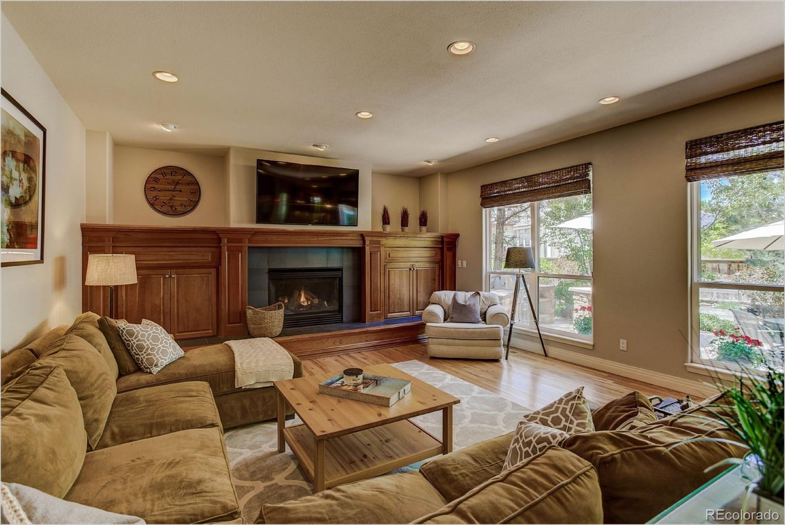 9425 South Shadow Hill Circle Lone Tree, CO 80124 - Photo 11 of 35 a living room with furniture and a fireplace