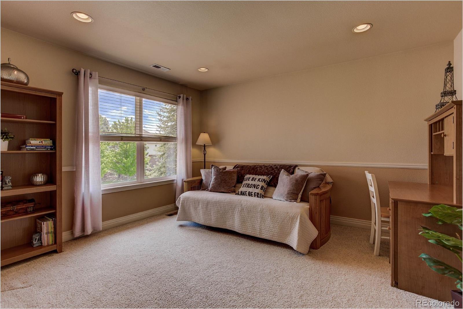 9425 South Shadow Hill Circle Lone Tree, CO 80124 - Photo 27 of 35 a living room with furniture and a window