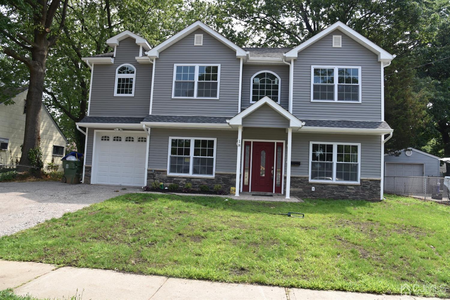 18 Dobson Road Edison, NJ 08817 - Photo 1 of 24 a front view of a house with a yard
