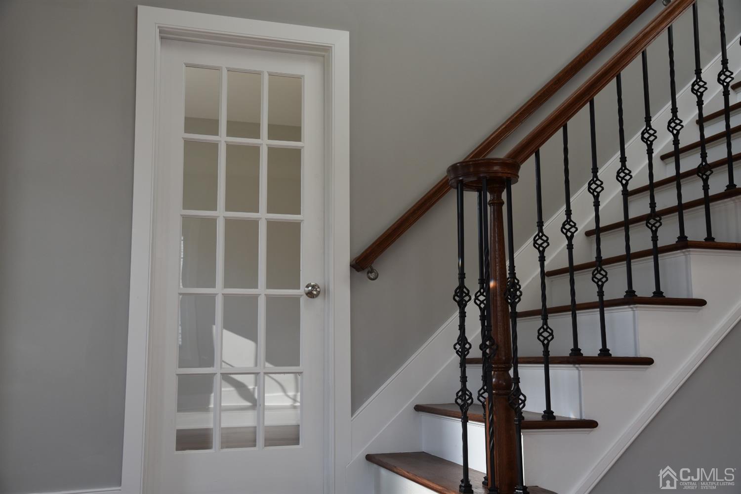 18 Dobson Road Edison, NJ 08817 - Photo 4 of 24 a view of staircase with wooden floor and white walls