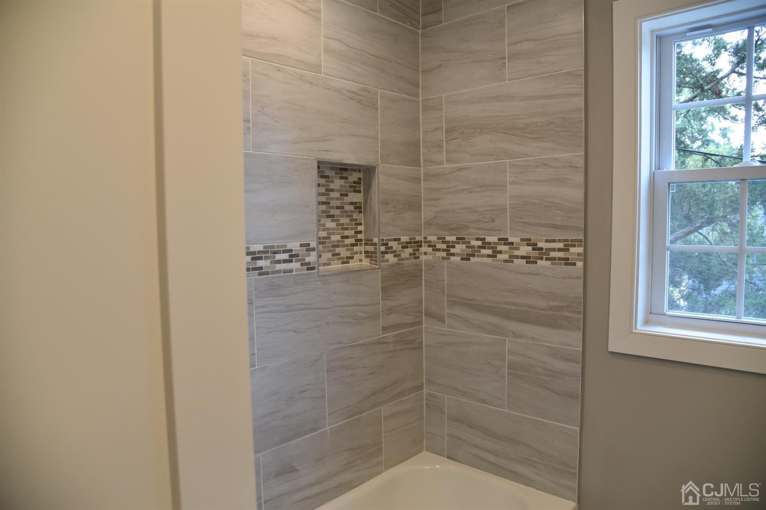 18 Dobson Road Edison, NJ 08817 - Photo 10 of 24 a bathroom with a shower