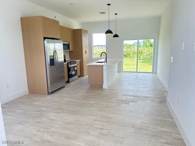 a view of a kitchen with a sink and dishwasher kitchen view
